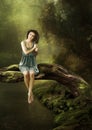 The girl sits on a tree over the water