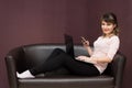 Freelancer does the job while sitting at home on the couch. Royalty Free Stock Photo