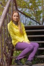 Girl sitting alone on the stairs.