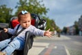 Girl sitting in a baby bike seat of a bicycle of her father safety emotions anxiety kids children parenting. Royalty Free Stock Photo