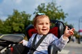 Girl sitting in a baby bike seat of a bicycle of her father safety emotions anxiety kids children parenting. Royalty Free Stock Photo