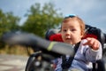 Girl sitting in a baby bike seat of a bicycle of her father safety emotions anxiety kids children parenting. Royalty Free Stock Photo