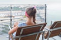 Girl sitting on balcony on background of bay of La Royalty Free Stock Photo