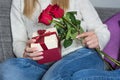 Celebrating Womanhood and Love: Woman with Red Rose and Gift Box