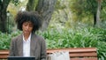 Girl sitting bench laptop close up. Smiling woman chatting using modern notebook Royalty Free Stock Photo