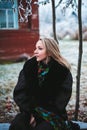 Girl sitting on a bench in the vill