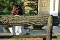 Girl sitting on a bench with your computer Royalty Free Stock Photo