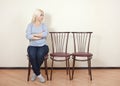 Girl sitting on a chair Royalty Free Stock Photo