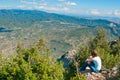 Girl sitting on a cliff Royalty Free Stock Photo