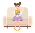 Girl is sitting on the couch and petting the cat. Young female character with a kitten in her arms