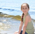 Girl sitting on a dock