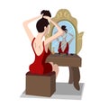 Girl sitting at dressing table and doing hair