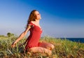 Girl sitting on a dune-3 Royalty Free Stock Photo