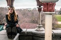 Girl sitting on edge of Belvedere Castle at Central Park in Manhattan, New York City Royalty Free Stock Photo