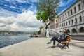 Girl sitting an embankment near Kuleli Military School, located on the Anatolian shore of Bosporus Royalty Free Stock Photo