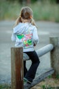 Girl Sitting on Fence