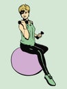 Girl sitting on a fitball with dumbbells