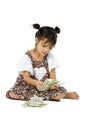 Girl sitting on floor and counting money Royalty Free Stock Photo