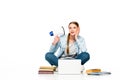 Girl sitting on floor with loudspeaker near laptop, books and copybooks Royalty Free Stock Photo