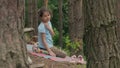 Girl sitting in the forest and talking slow motion video