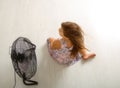 The girl is sitting in front of the fan Royalty Free Stock Photo