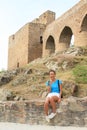 Girl sitting in front of unique bridge on Velhartice Castle Royalty Free Stock Photo