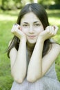 Girl sitting on grass in park