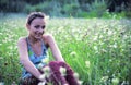 Girl sitting in grass smiling