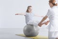 Girl sitting on gym ball Royalty Free Stock Photo