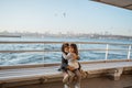 girl sitting with her sister on a ferryboat