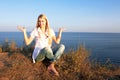 Girl sitting on a mountain