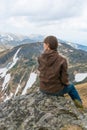 Girl is sitting on a mountain top Royalty Free Stock Photo