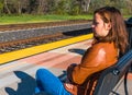 Girl Sitting Near Train Rails Royalty Free Stock Photo