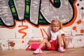 Girl sitting near the wall Royalty Free Stock Photo