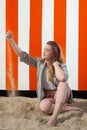 Girl playing sand hut, De Panne, Belgium Royalty Free Stock Photo