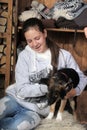 Girl sitting with a puppy. Close Royalty Free Stock Photo