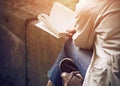 A girl sitting reading classical literature