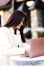 A girl sitting in a restaurant on the street Royalty Free Stock Photo