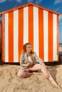 Girl beach sun sand hut, De Panne, Belgium
