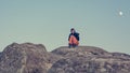 Girl sitting on a sandstone rock Royalty Free Stock Photo