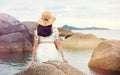 Girl sitting on the seaside rocks Royalty Free Stock Photo