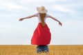 Girl sitting on shoulders of men in wheat field background. Romantic couple in countryside Royalty Free Stock Photo