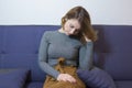 Girl sitting on a sofa in the office of a psychologist talks about her problems. The concept of a psychological consultant