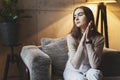 Girl sitting on sofa and relaxing at home. Casual clothes for young people. Leisure activities for relaxation and having rest Royalty Free Stock Photo