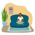 A girl sitting on the sofa works on the laptop.Vector flat illustration