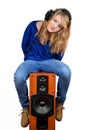 The girl sitting on the speaker Royalty Free Stock Photo