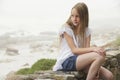 Girl Sitting On Stone Wall Royalty Free Stock Photo