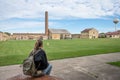 girl sitting at a table in the main courtyard of Old Joliet Prison, a former abandoned jail