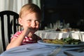 Girl sitting at a table in a restaurant and eats