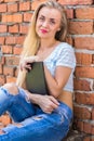 Girl sitting with a tablet